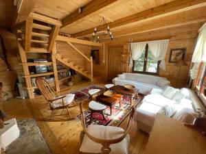 an overhead view of a living room in a log cabin at Fireplace Chalet in Žabljak