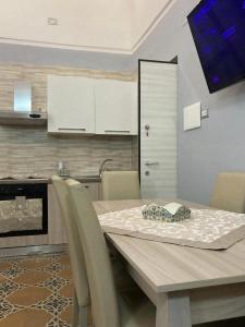 a dining table and chairs in a kitchen at Keteia Amalfi Coast in Cetara