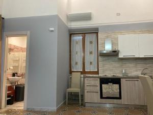 a kitchen with a sink and a stove top oven at Keteia - Amalfi Coast in Cetara +6 photos