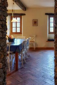 a dining room with a table and chairs at Villa Rustica in Sorico