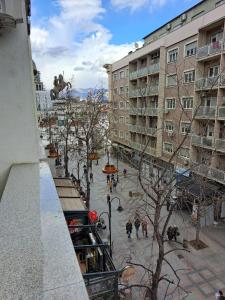 a view from a balcony of a city with buildings at Alpi Hostel in Skopje