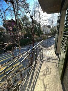 a metal railing on a sidewalk next to a street at Luxuswohnung in der Stadt Bern in Bern