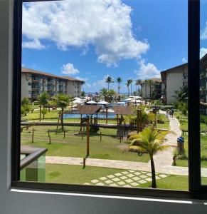 a view from a window of a resort with a park at Polinesia Resort - Porto de Galinhas - Apartamentos com somente 1 opção de Térreo com Piscina Privativa - Acesso ao Hotel Samoa in Porto De Galinhas