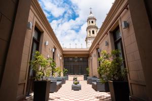 a view of a building with a clock tower in the background at Loft Osteria by Sagardi in Buenos Aires