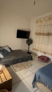 Postel nebo postele na pokoji v ubytování Casa Aconchego Recanto Santa Fé