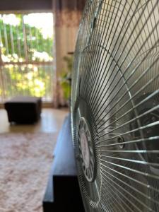 a close up of a bench with a fan at MD comfort living in Kampala
