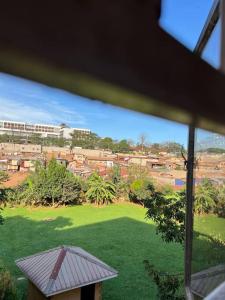 a view from a window of a field of green grass at MD comfort living in Kampala