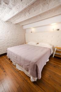 a bedroom with a large bed in a room at Loft Osteria by Sagardi in Buenos Aires +179 photos