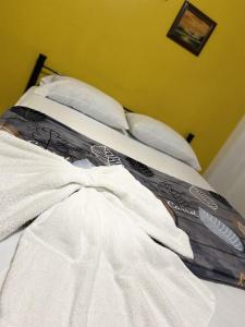 Ein Bett oder Betten in einem Zimmer der Unterkunft Hotel Quinta Avenida
