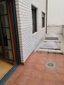 a building with a drain in the middle of a patio at Estudio Céntrico A1 in Oviedo