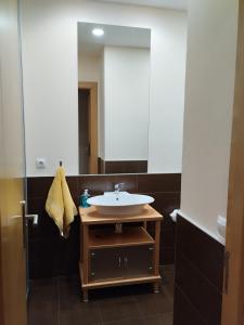 a bathroom with a sink and a mirror at Estudio Céntrico A1 in Oviedo