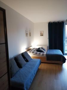 Posteľ alebo postele v izbe v ubytovaní Apartament Przy Plaży Gdańsk