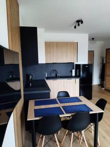 Kuchyňa alebo kuchynka v ubytovaní Apartament Przy Plaży Gdańsk