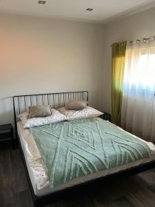 Una cama o camas en una habitación de Apartament Dzień Dobry