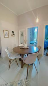 a dining room with a table and two chairs at Apartment with spacious terrace Villa Floramy in Opatija