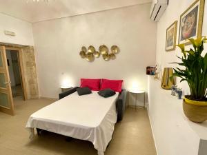 Ένα ή περισσότερα κρεβάτια σε δωμάτιο στο Il Reginale Deluxe