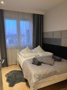 Postel nebo postele na pokoji v ubytování Pod Żaglami Gdańsk Brzeźno