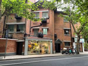 a store in front of a brick building at Shanghai Hills & Serendipity Roof House in Shanghai