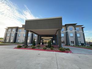 a rendering of a building with a driveway at Hawthorn Extended Stay by Wyndham Port Arthur in Port Arthur