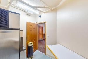 an empty room with a door and a hallway at Village Hideaway in Copper Mountain