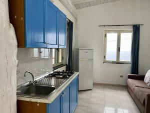 A kitchen or kitchenette at Residence Araba Fenice Tropea