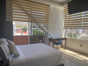 Postel nebo postele na pokoji v ubytování Hotel Zócalo Chilpancingo