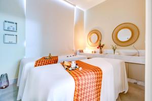 Cama ou camas em um quarto em DoubleTree by Hilton - Resort - Foz do Iguaçu