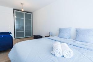 En eller flere senge i et værelse på Élégance et confort- Vidéoprojecteur Tours-Parking