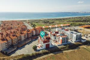 an aerial view of a building near the ocean at Best Houses 02 - Brand New, Modern & Cozy - Steps From The Beach in Consolacao