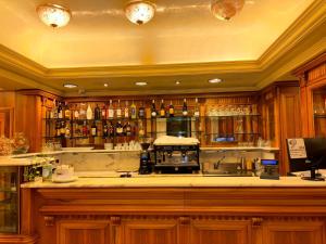 a kitchen with a bar with a lot of alcohol at Hotel Ristorante Ca' Nova in Marghera