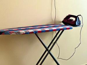 a shelf with a red white and blue stripes at F.A.M Homes Tabata in Dar es Salaam