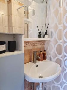 a bathroom with a sink and a mirror at Apartment in private villa in Gryta