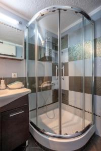 a shower with a glass enclosure in a bathroom at Luxurious Sani Villa Luna with shared pool in Sani Beach
