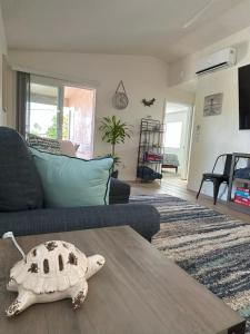 a living room with a turtle on a coffee table at Oceanside Getaway at Tuscan Village Condominiums in Oceanside