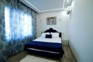 Ένα ή περισσότερα κρεβάτια σε δωμάτιο στο La cozy suite