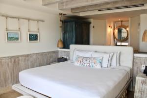 Postel nebo postele na pokoji v ubytování Naay Boutique Hotel Holbox