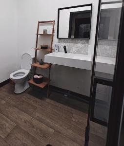 een badkamer met een witte wastafel en een toilet bij Private Room in center of Charleroi in Charleroi