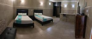 Ein Bett oder Betten in einem Zimmer der Unterkunft Villas Bayal