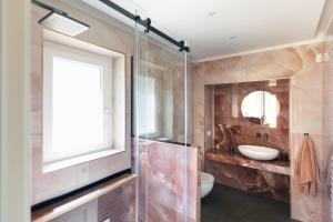 a bathroom with a glass shower and a sink at Villa - La Formica Gentile - Monopoli in Gorgofreddo +26 photos