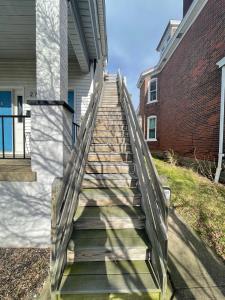 a stairway leading up to a brick building at Unwind in a Bright Comfortable Apartment for 3 in Pittsburgh