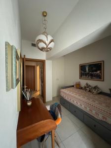 a bedroom with a bed and a desk in it at Casa. Grassi in Siena