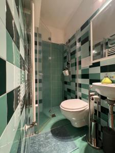a bathroom with a toilet and a sink at Casa. Grassi in Siena