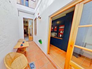 a room with a table and a table and a door at PREMIUM HABITAT LA PICORDIA in Arenys de Mar