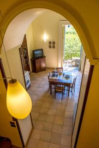 a room with a table and a dining room at Flat Rosanna in Sorrento