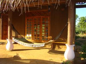 a hammock in the front of a building at La Serenado in Kataragama