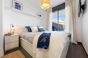 Posteľ alebo postele v izbe v ubytovaní Hauzify I Apartaments Roques Daurades