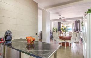 a kitchen and dining room with a table and chairs at Casa con acceso directo a la playa de Mojácar in Mojácar