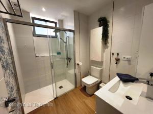 a bathroom with a shower and a toilet and a sink at OCEAN MARINA GOLF Villa in San Miguel de Abona