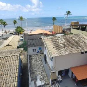 an aerial view of buildings and the beach at hostel quintal da sereia in Salvador