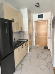Kuchyň nebo kuchyňský kout v ubytování Viva apartment in condominium
